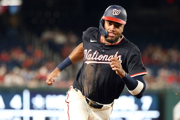 Washington Nationals' James Wood scores during the eighth inning of a baseball game against the Detroit Tigers, Thursday, July 3, 2025, in Washington. (AP Photo/Daniel Kucin Jr.)