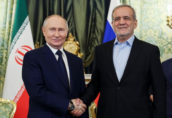 FILE - Russian President Vladimir Putin, left, and Iranian President Masoud Pezeshkian pose for a photo during their meeting at the Kremlin in Moscow, Russia, on Jan. 17, 2025. (Vyacheslav Prokofyev, Sputnik, Kremlin Pool Photo via AP, File)