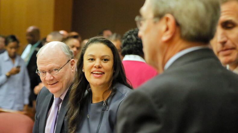 Attorney Charles Huddleston (left) and Meria Carstarphen, superintendent of Atlanta Public Schools, are all smiles after a judge on Friday  agreed to allow Fulton County to collect tax money. The school district will still have to furlough some employees in November.  BOB ANDRES  /BANDRES@AJC.COM