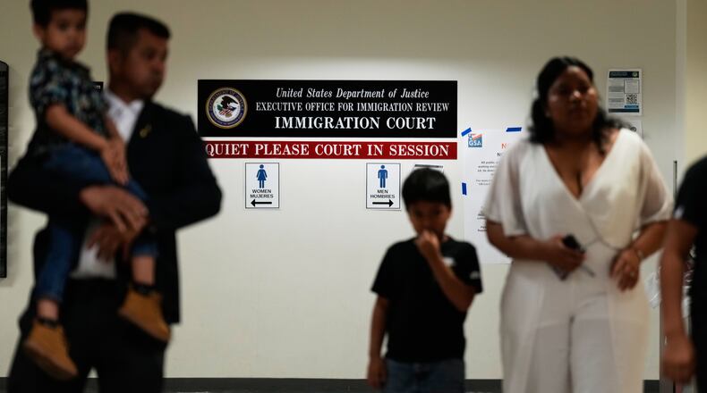 People arrive for immigration court hearings in New York, Monday, July 27, 2026. (AP Photo/Seth Wenig)