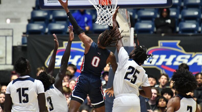 March 12, 2022 Macon - Berkmar's Jameel Rideout (0) goes up for the shot past Norcross' Mier Panoam (3) and Norcross' Hezekiah Flagg (25) during the 2022 GHSA State Basketball Class AAAAAAA Boys Championship game at the Macon Centreplex in Macon on Saturday, March 12, 2022. (Hyosub Shin / Hyosub.Shin@ajc.com)