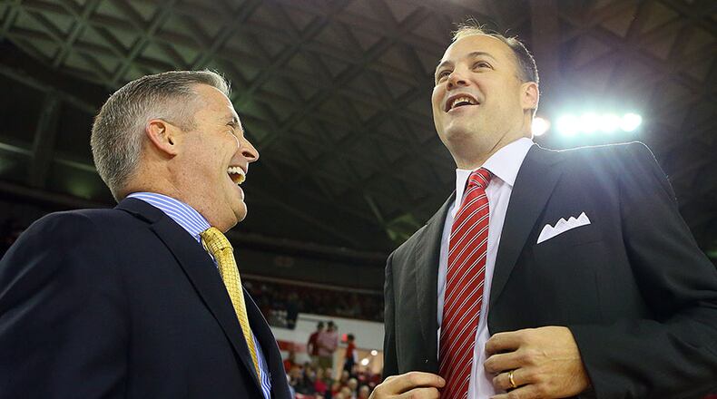 111513 ATHENS: Georgia Tech head coach Brian Gregory (left) and Georgia Bulldogs head coach Mark Fox share a laugh as they greet each other on the court before tip off in their game on Friday, Nov. 15, 2013, in Athens. CURTIS COMPTON /staff CCOMPTON@AJC.COM Wonder if Mark Fox will be laughing when he hears Brian Gregory has been talking to Tom Izzo. (Curtis Compton, AJC)