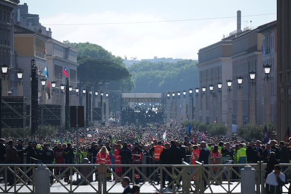 People queue trying to reach St. Peter's Square ahead of the funeral of Pope Francis at the Vatican, Saturday, April 26, 2025. (AP Photo/Andrew Medichini)