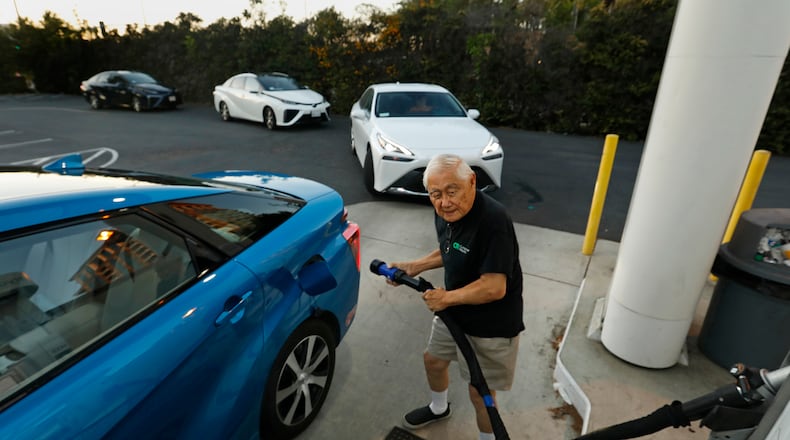 Richard Wong fills his hydrogen-fueled vehicle at a station in Irvine, California. A coalition of Georgia political, business and clean energy leaders are seeking to bring a new regional hydrogen hub to Georgia and the Southeast. (Carolyn Cole/Los Angeles Times/TNS)