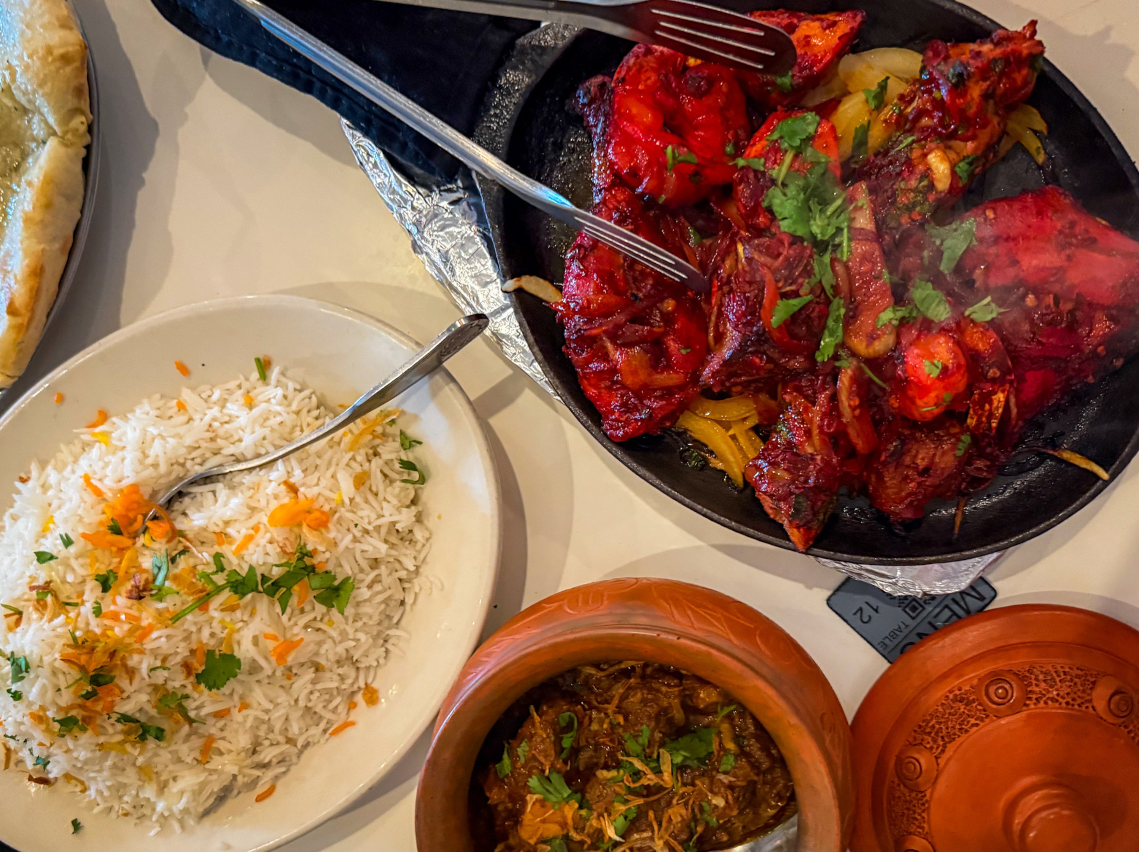 Ruchi's mixed tondoori platter includes shrimp, two kinds of chicken and lamb. (Henri Hollis/AJC)