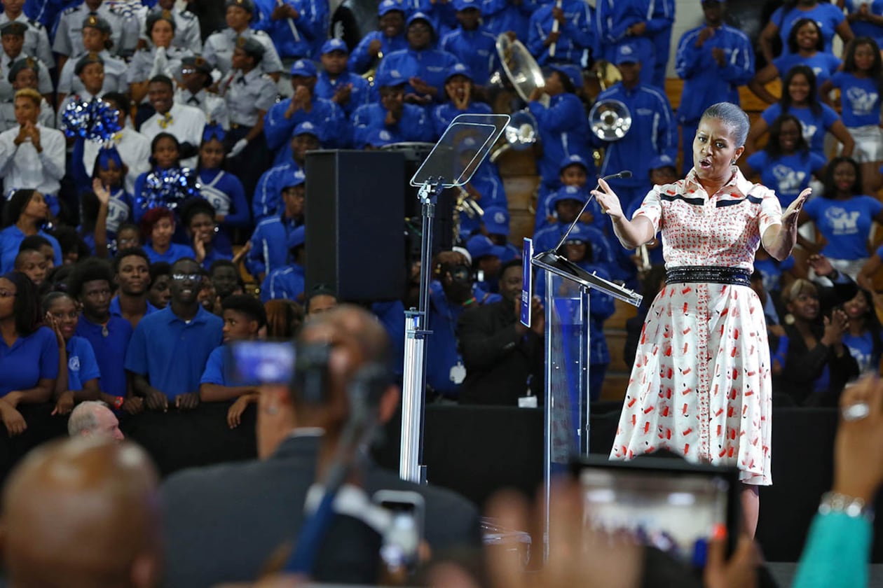 Michelle Obama visited Booker T. Washington High School as part of her “Reach Higher” campaign to increase the number of college graduates. The public high school in Atlanta has more than three times the students living in poverty and hundreds of open seats, writes guest contributor Raymond Pierce. (Bob Andres/AJC 2014)