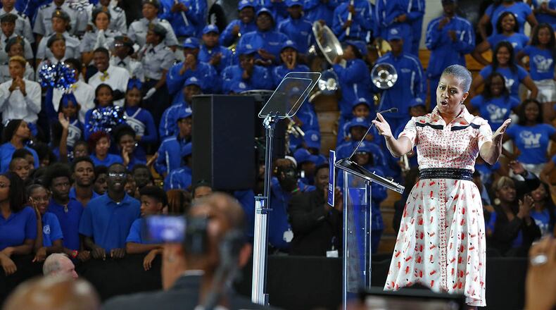 Michelle Obama visited Booker T. Washington High School as part of her “Reach Higher” campaign to increase the number of college graduates. The public high school in Atlanta has more than three times the students living in poverty and hundreds of open seats, writes guest contributor Raymond Pierce. (Bob Andres/AJC 2014)