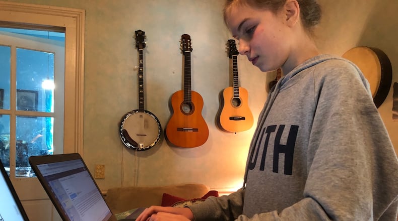 Seraphina Guess, 12, attends seventh grade online from her home in Madison County.