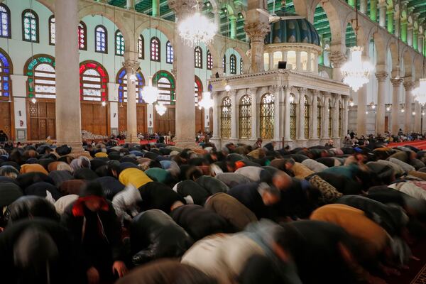 Muslim worshippers pray during the Muslim holy month of Ramadan at the Umayyad Mosque in Damascus, Syria, Friday March 7, 2025. (AP Photo/Omar Sanadiki)