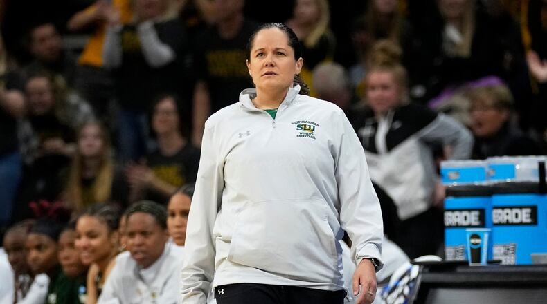 FILE - Southeastern Louisiana head coach Ayla Guzzardo watches from the bench in the first half of a first-round college basketball game against Iowa in the NCAA Tournament, March 17, 2023, in Iowa City, Iowa. (AP Photo/Charlie Neibergall, File)