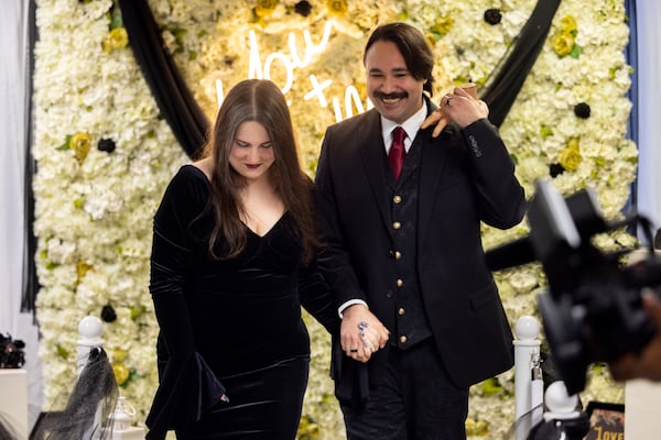 Christie Kovach and Derik Costa were married Friday on Halloween. (Arvin Temkar/AJC)