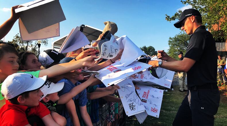 ATLANTA, GA - SEPTEMBER 23: (EDITORS NOTE: Image was created and digitally altered with an iPhone.) Jordan Spieth signs autographs during the third round of the TOUR Championship, the final event of the FedExCup Playoffs, at East Lake Golf Club on September 23, 2017 in Atlanta, Georgia. (Photo by Brad Mangin/PGA TOUR)