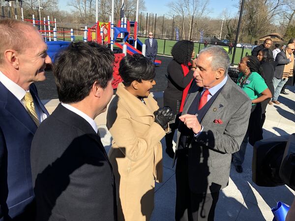 Atlanta Super Bowl Host Committee officials Brett Daniels, left, Dan Corso, Mayor Keisha Lance Bottoms and Falcons owner Arthur Blank talk at the re-opening celebration of John F. Kennedy Park. NFL Commissioner Roger Goodell, Blank and Bottoms helped commemorate the re-opening of the park, which underwent a five-month renovation as part of a gift from the NFL Foundation and the Atlanta Super Bowl Host Committee. J. SCOTT TRUBEY/STRUBEY@AJC.com