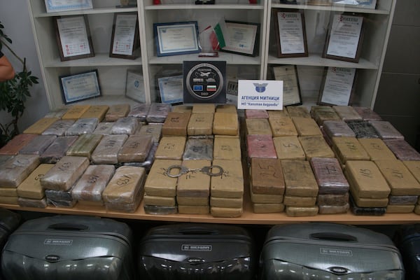 Sealed bags of cocaine which were hidden in suitcases, seen below, and seized by Bulgarian border authorities, are displayed at a border customs' office in Kapitan Andreevo, Bulgaria, Sunday, July 20, 2025. (Bulgarian Interior Ministry via AP)