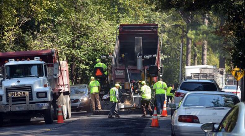 Asphalt patching will slow traffic through Berkeley Lake. AJC File Photo