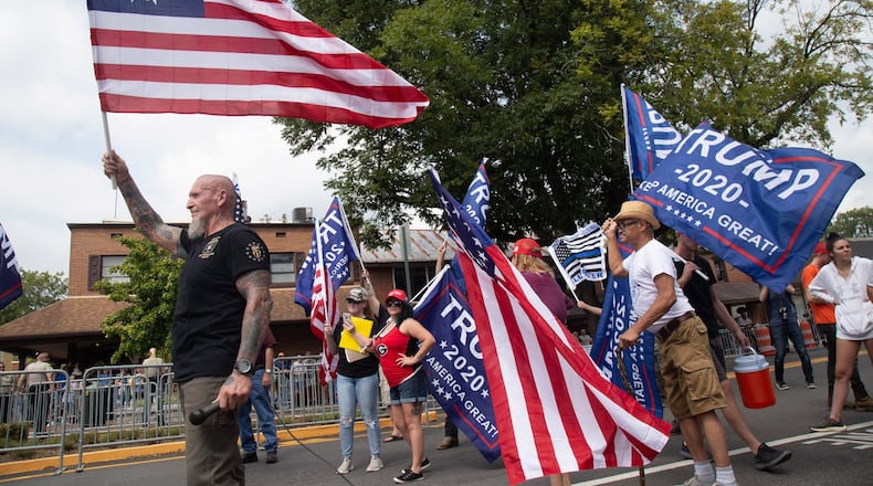 Chester Doles, the principal organizer of Saturday’s pro-Trump rally in Dahlonega, waves a flag at the beginning of the rally September 14, 2019. Republicans distanced themselves from the event that attracted white nationalists and supremacists. (Photo by STEVE SCHAEFER / SPECIAL TO THE AJC)