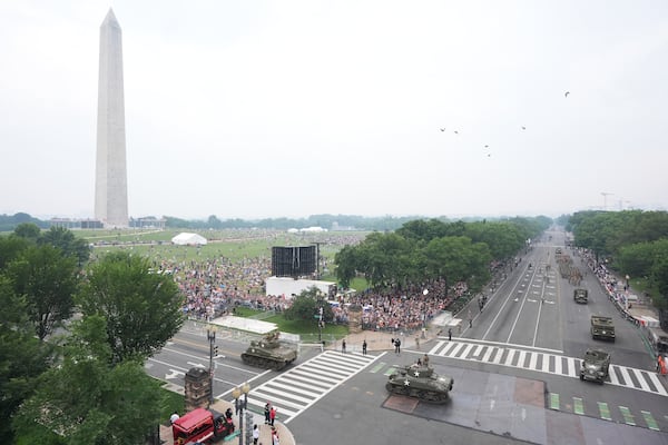 A military parade commemorating the Army's 250th anniversary and coinciding with President Donald Trump's 79th birthday, Saturday, June 14, 2025, in Washington. The Washington Monument stands left. (AP Photo/Jacquelyn Martin)