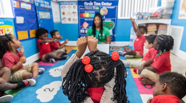 Prekindergarten teacher Kaira Cawthon demonstrates bringing together single words into compound words on Oct. 1 at Park Avenue Child Care in Apopka, Florida. (Willie J. Allen Jr./Orlando Sentinel/TNS)