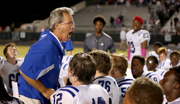 Mark Fleetwood went on the coach high school football. Here, he celebrates Peachtree Ridge's 31-0 win over Norcrossin 2015. (Jason Getz/AJC)