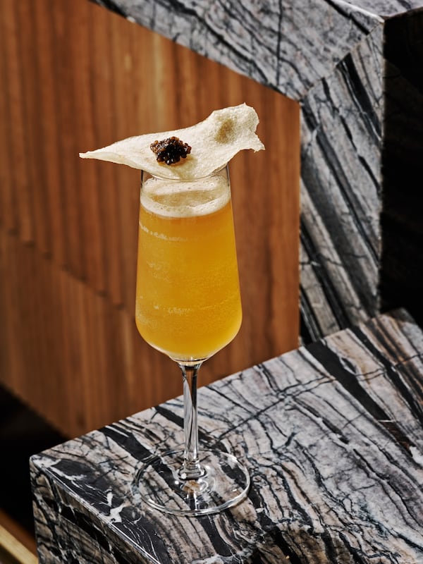 The Real McCoy at Zephyr Southern Brasserie is garnished with a house-made potato chip and caviar. (Courtesy of Andy Lee)