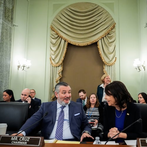 FILE - Sen. Ted Cruz, R-Texas, left, chairman of the Senate Commerce, Science and Transportation Committee, speaks with Sen. Maria Cantwell, D-Wash., right, before a hearing Wednesday, Nov. 19, 2025, on Capitol Hill in Washington. (AP Photo/Julia Demaree Nikhinson,File)
