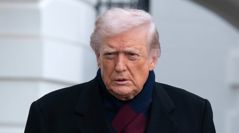 President Donald Trump talks to reporters as he departs from the South Lawn of the White House, Saturday, Dec. 13, 2025, in Washington, en route to Baltimore to attend the Army-Navy football game. (AP Photo/Jose Luis Magana)
