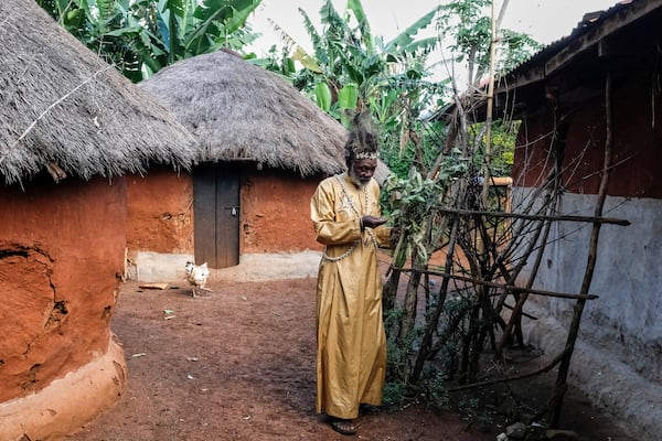 Seer Atukung Tafala walks around his igloo-like shrine in Kampala, Uganda Saturday, June 21, 2025. (AP Photo/Hajarah Nalwadda)