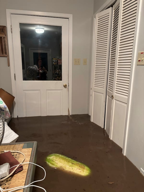 Water leaks through a door jamb in Alden Towler's cabin in Hunt, Texas, at 4:15 a.m. on Friday, July 4, 2025. (Shabd Simon-Alexander via AP)