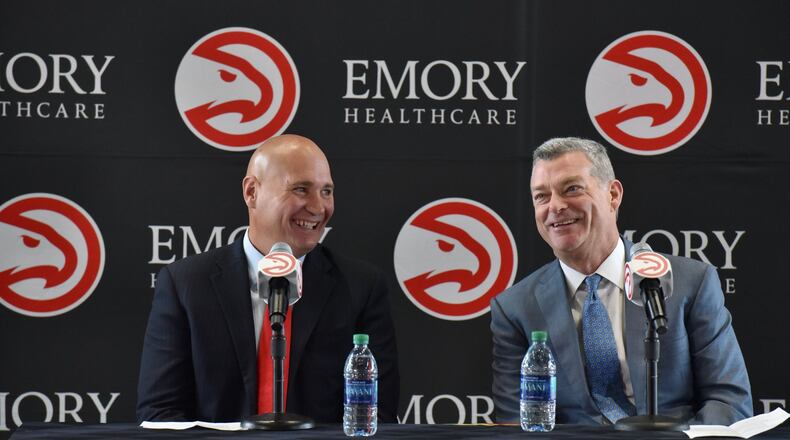 New Hawks GM Travis Schlenk (left) and Hawks principal owner Tony Ressler share a laugh before the press conference at Philips Arena on Friday, June 2, 2017. HYOSUB SHIN / HSHIN@AJC.COM