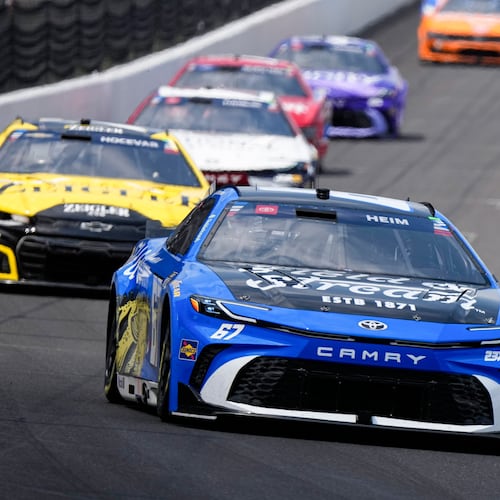 Corey Heim heads into the first turn during the NASCAR Cup Series auto race at Indianapolis Motor Speedway in Indianapolis, Sunday, July 26, 2026. (AP Photo/Michael Conroy)