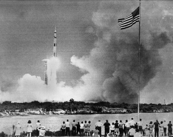 In 1970, crowds watched the liftoff of the Saturn V rocket carrying the Apollo 13 spacecraft on its mission to the moon.