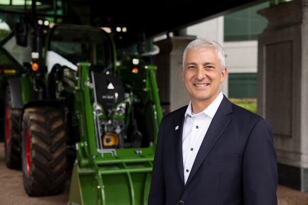 AGCO CEO Eric Hansotia said the company has signed a 15-year lease to stay at its Duluth headquarters because “We have good connectivity to farming in the area. … There’s a lot of advantages, and we’ve had good luck here.” (Jason Getz/AJC)