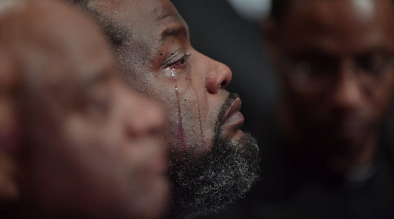 JANUARY 25, 2017 LITHONIA A mourner reacts during the Home-going services for Bishop Eddie Long, senior pastor, at New Birth Missionary Baptist Church, Wednesday, January 25, 2017. Bishop Long died January 15th, after a long-time fight with cancer. He was 63 years old. Hyosub Shin/AJC