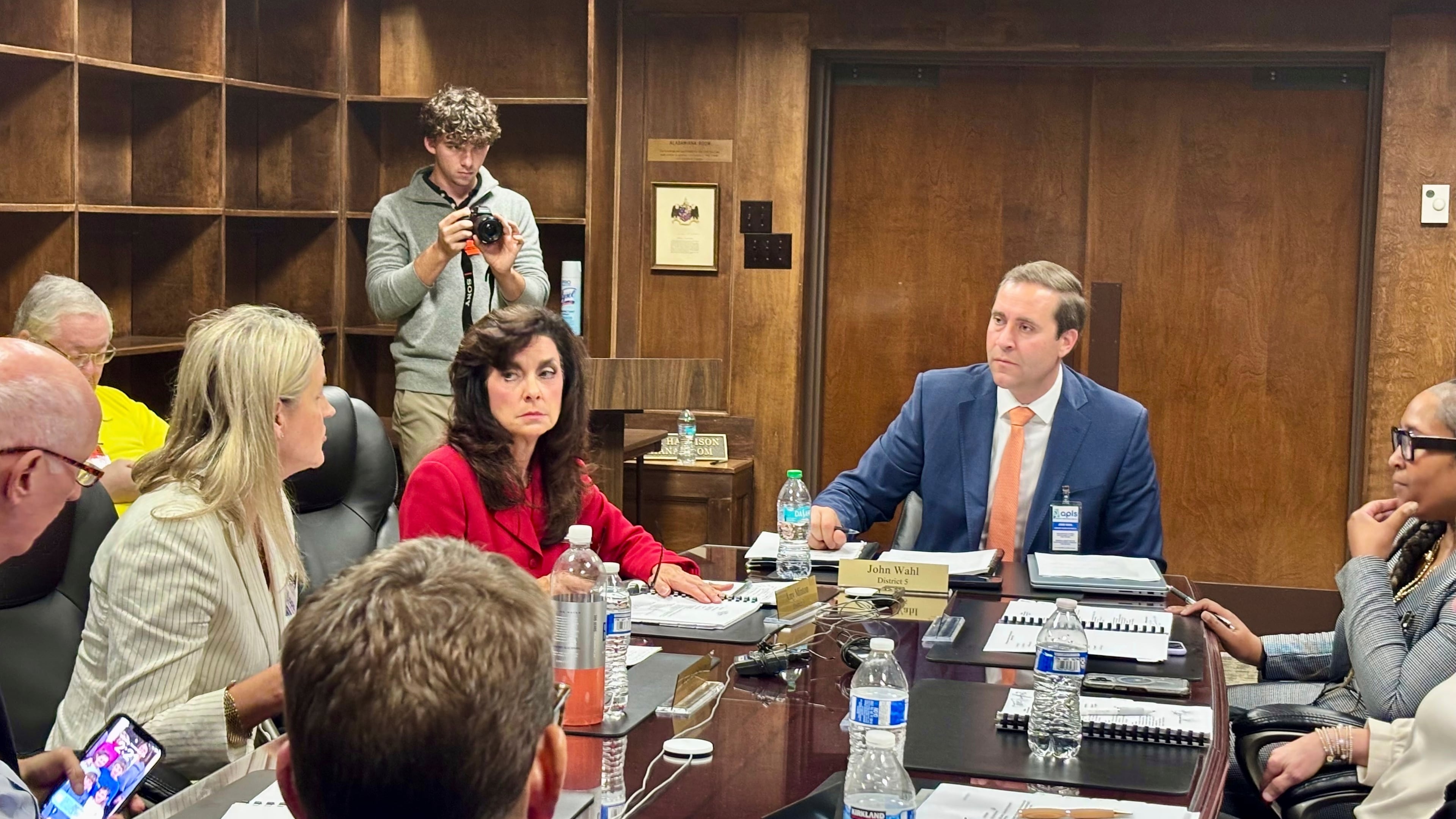 John Wahl, chairman of the Alabama Public Library Service Board of Directors, center right, listens during a meeting in Montgomery, Ala., Thursday, Nov. 20, 2025. (AP Photo/Kim Chandler)
