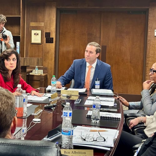 John Wahl, chairman of the Alabama Public Library Service Board of Directors, center right, listens during a meeting in Montgomery, Ala., Thursday, Nov. 20, 2025. (AP Photo/Kim Chandler)