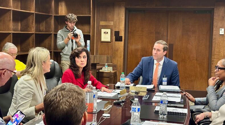 John Wahl, chairman of the Alabama Public Library Service Board of Directors, center right, listens during a meeting in Montgomery, Ala., Thursday, Nov. 20, 2025. (AP Photo/Kim Chandler)