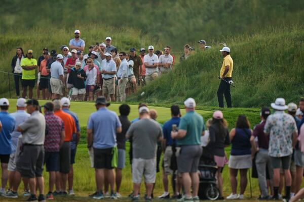Brooks Koepka prepares to putt on the 10th hole during the second round of the U.S. Open golf tournament at Oakmont Country Club Friday, June 13, 2025, in Oakmont, Pa. (AP Photo/Seth Wenig)