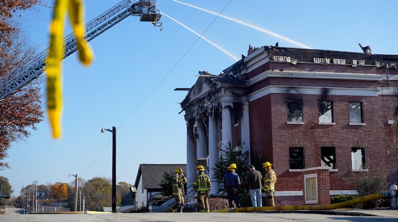 Gwinnett County firefighters continue working at First Pentecostal Church of Buford Friday, Nov. 29, 2024. (Ben Hendren for the Atlanta Journal-Constitution)