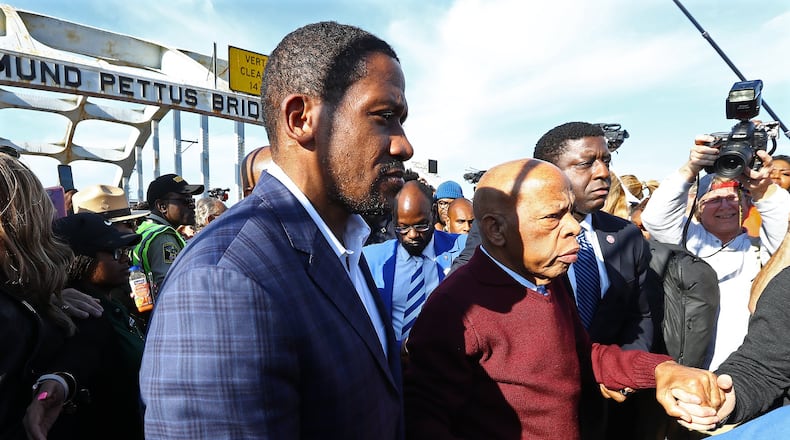 Michael Collins, left, was the chief of staff to U.S. Rep. John Lewis. He's now serving as a special assistant to Vice President Kamala Harris. “I never imagined what the congressman’s passing would mean to me,” Collins said recently. “It came in waves of processing his passing. He was a boss. He was a father figure. He was a mentor. He was a confidant. And I lost all of that at once.” (Curtis Compton/The Atlanta Journal-Constitution)