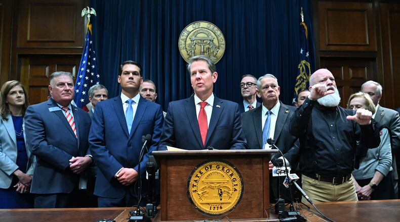 March12, 2020 Atlanta - Gov. Brian Kemp speaks as other officials standing behind during a press conference to provide an update on the state's efforts regarding COVID-19, after reporting the first death in Georgia related to coronavirus, at the Georgia State Capitol on Thursday, March 11, 2020. (Hyosub Shin / Hyosub.Shin@ajc.com)