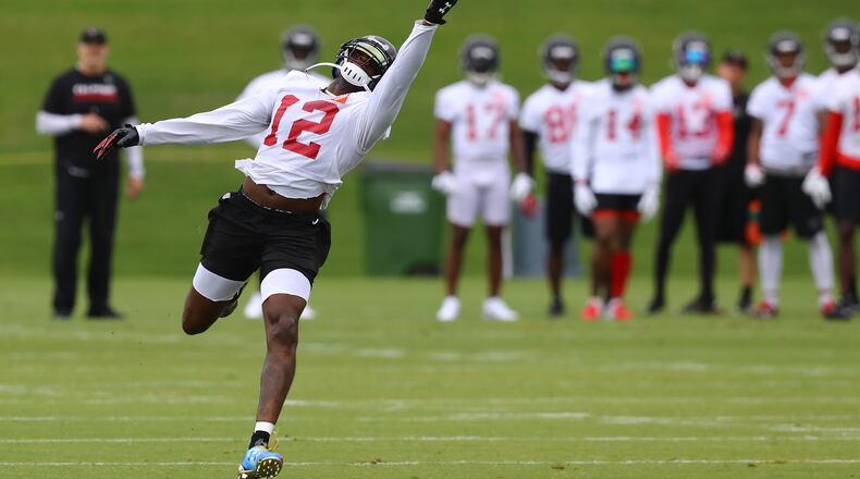 Mohamed Sanu goes out for a long pass leading the wide receivers through routes with Dan Quinn looking on during the first day of mandatory minicamp on Tuesday, June 12, 2018, in Flowery Branch.  Curtis Compton/ccompton@ajc.com