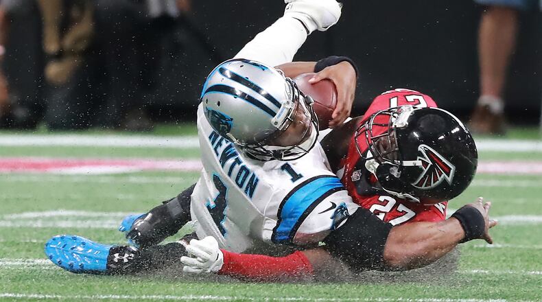Atlanta Falcons safety Damontae Kazee levels Carolina Panthers quarterback Cam Newton and is ejected from the game during the second quarter on Sunday, Sept. 16, 2018, at Mercedes-Benz Stadium in Atlanta.