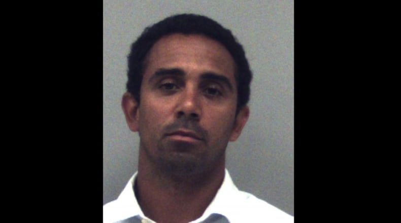 Former UGA wide receiver and Gwinnett County teacher "Mikey” Henderson was arrested May 19 on one charge of sexual assault.