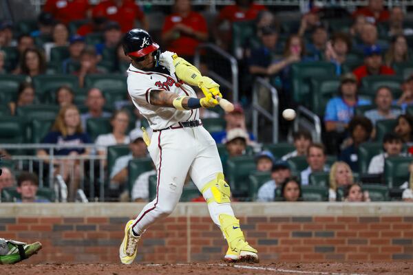Braves right fielder Ronald Acuña Jr. hits an RBI single against the Mets on Monday, Aug. 10, 2026, in Atlanta. (Jason Getz/AJC)