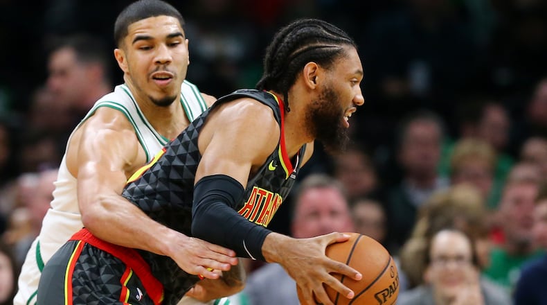 DeAndre' Bembry #95 of the Atlanta Hawks drives against Jayson Tatum #0 of the Boston Celtics during the game between the Boston Celtics and the Atlanta Hawks at TD Garden on December 14, 2018 in Boston, Massachusetts. (Photo by Maddie Meyer/Getty Images)