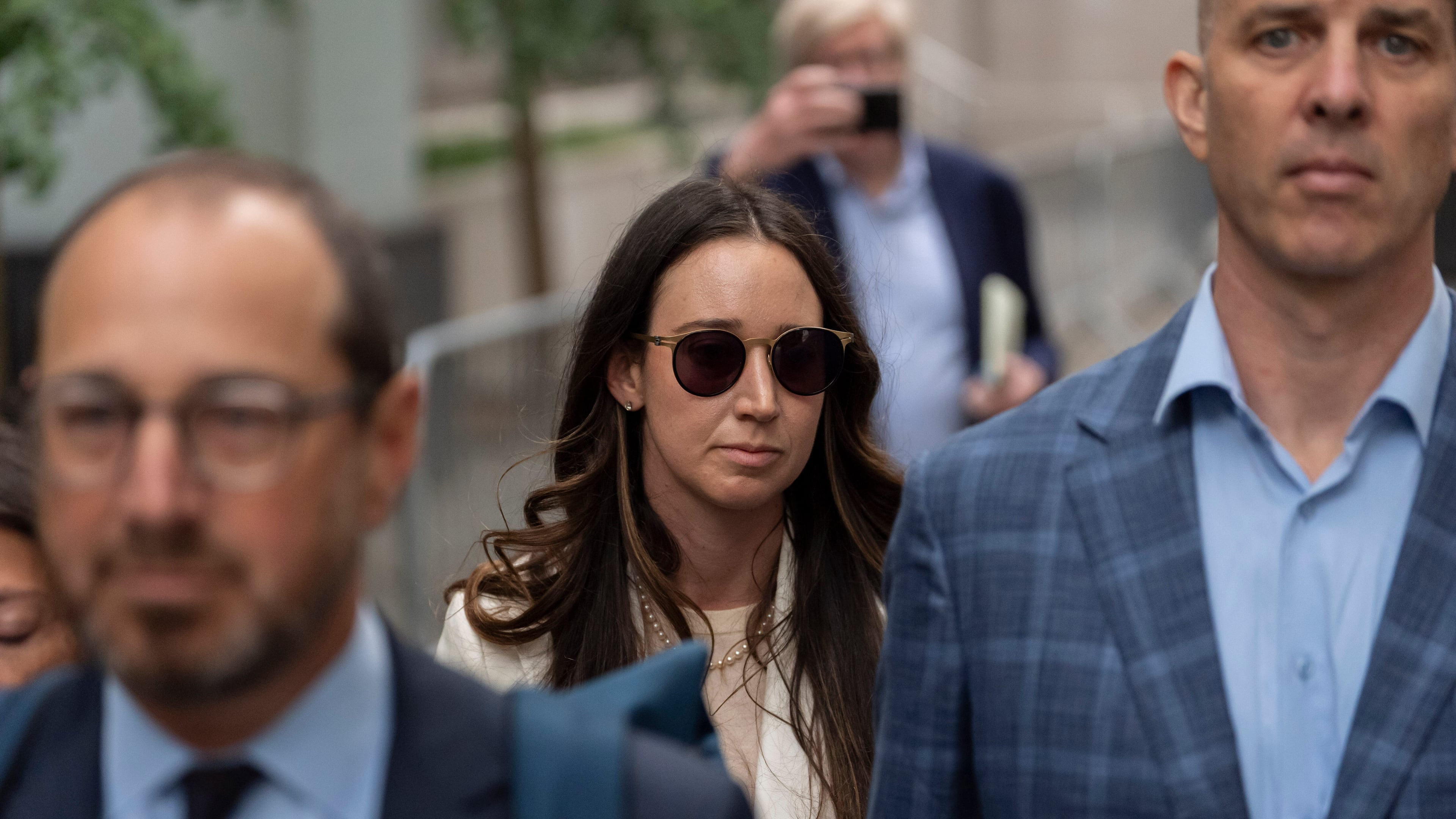 Charlie Javice, center, exits Manhattan federal court, Monday, Sept. 29, 2025, in New York. (AP Photo/Yuki Iwamura)