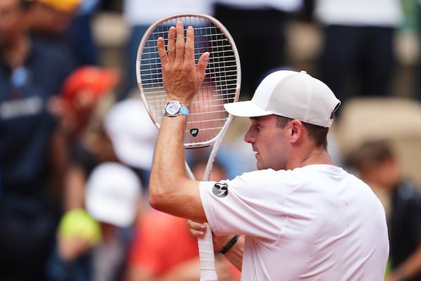 Tommy Paul of the U.S. reacts after beating Australia's Alexei Popyrin during their fourth round match of the French Tennis Open, at the Roland-Garros stadium, in Paris, Sunday, June 1 2025. (AP Photo/Lindsey Wasson)