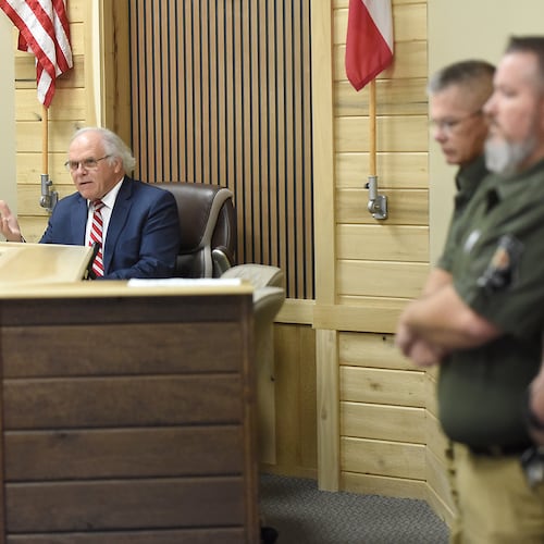 Members of the Cohutta Police Department look on as Mayor Ron Shinnick speaks at Cohutta Town Hall in Cohutta, Ga. on Thursday, April 30, 2026. (Matt Hamilton/Chattanooga Times Free Press via AP)