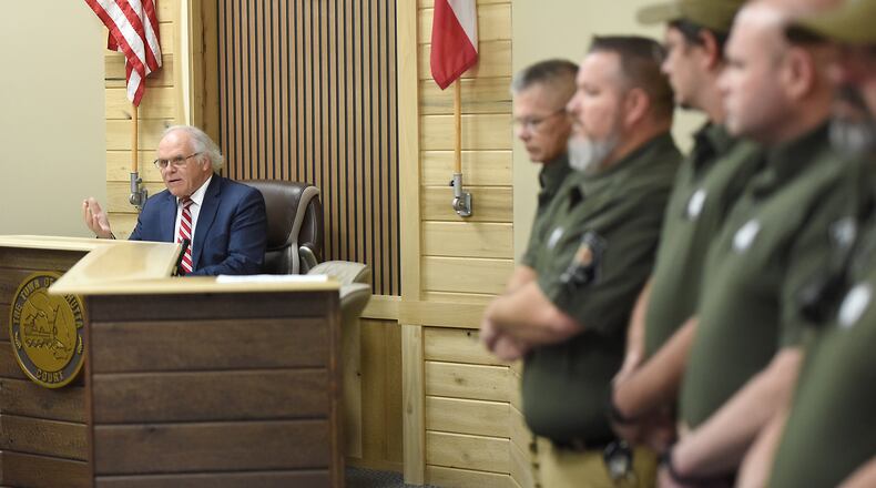 Members of the Cohutta Police Department look on as Mayor Ron Shinnick speaks at Cohutta Town Hall in Cohutta, Ga. on Thursday, April 30, 2026. (Matt Hamilton/Chattanooga Times Free Press via AP)