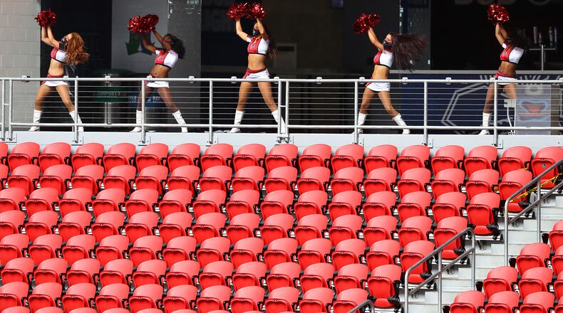 The Atlanta Falcons cheerleader squad was reduced to five members performing to empty seats at Mercedes-Benz Stadium during the season-opening game against the Seattle Seahawks Sunday, Sept. 13, 2020, in Atlanta. (Curtis Compton / Curtis.Compton@ajc.com)